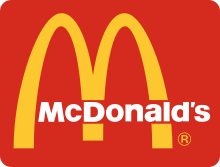 “McDonald’s Cleaning: Enhancing Brand Image with Professional Maintenance” "McDonald's building undergoing professional exterior cleaning with high-pressure washing for a spotless look, carpark cleaning.