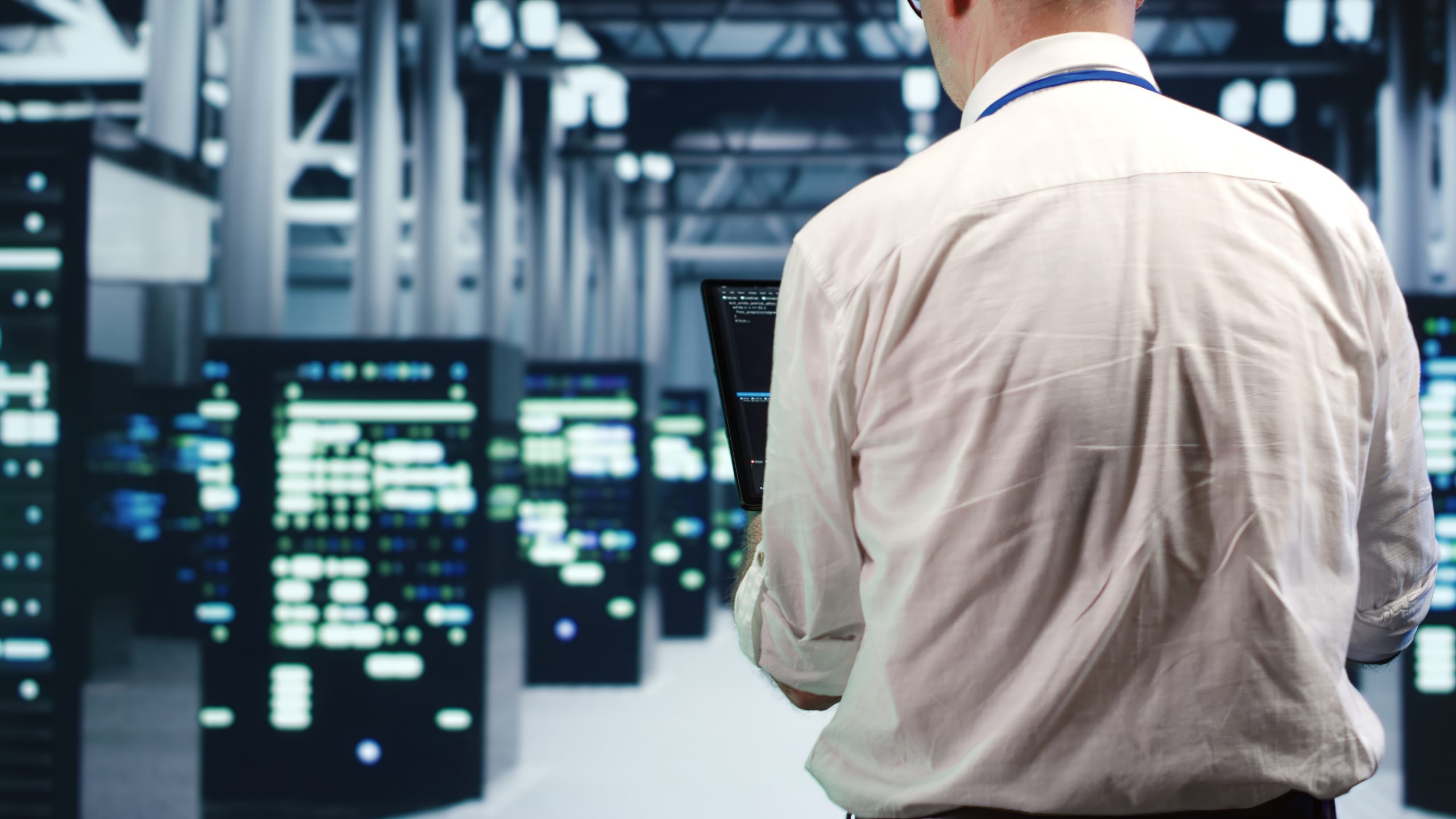 Professional Data Center Cleaning Services for Secure and Efficient IT Infrastructure IT professional monitoring servers in a data center, ensuring a clean and dust-free environment for optimal performance